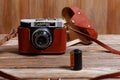 Old vintage retro photo camera Smena-8 on wooden background