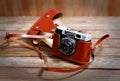 Old vintage retro photo camera Smena-8 on wooden background