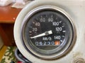 Old vintage retro round speedometer with sleeper in kilometers per hour. Riding speed measuring device
