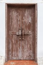 Old vintage retro style wood door with wooden bolt Royalty Free Stock Photo