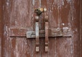 Old vintage retro style wood door with wooden bolt Royalty Free Stock Photo