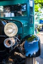 Old vintage retro truck with wooden cabin and open engine at a provincial town street exhibition Royalty Free Stock Photo