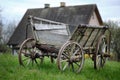 Old vintage rural rusty Amish timber open wagon. Pulled pushed vehicle for transporting hey, crops, or people.