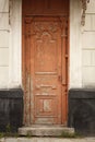 Old vintage rustic exterior red door detail on old brick building Royalty Free Stock Photo