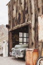 Old vintage rusty car truck abandoned in the abandoned gas station. Royalty Free Stock Photo