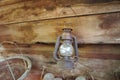 old vintage rusty kerosene lamp was hung on the wooden wall. Royalty Free Stock Photo