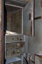 An old vintage rusty metal safe with an open door. Antique office safe for storing documents Royalty Free Stock Photo