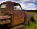 OLD RUSTY TRUCK IN A FIELD Royalty Free Stock Photo