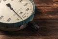 Old vintage scales with arrows, canter on a wooden background