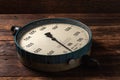 Old vintage scales with arrows, canter on a wooden background