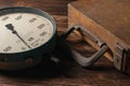 Old vintage scales with arrows, canter on a wooden background