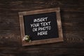 Old vintage school slate with flowers Royalty Free Stock Photo