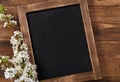 Old vintage school slate with flowers Royalty Free Stock Photo