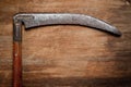 Old vintage scythe of the last century extracted from the chest in the workshop of grandfather. Background for craftsmanship and