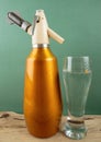 Old vintage siphon and glass of water Royalty Free Stock Photo