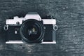 Old vintage SLR Film camera on wood background Royalty Free Stock Photo