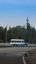 Old vintage Soviet KavZ minibus on the highway in the woods