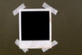 Old vintage stained polaroid style blank photo print frame sticky tape