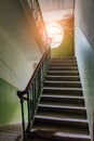 Old vintage staircase at the old house. Oval window Royalty Free Stock Photo