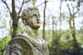 Old stone statue in Brussels public park with red painted colored lips with lipstick or paint Royalty Free Stock Photo