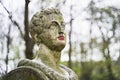 Old stone statue in Brussels public park with red painted colored lips with lipstick or paint Royalty Free Stock Photo