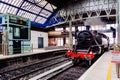 Old vintage steam train entering Connolly Station, Dublin, Ireland