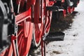 Old vintage steam train, locomotive, train with red wheels, old carriages, close-up to the wheels Royalty Free Stock Photo