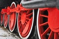 Old vintage steam train, locomotive, train with red wheels, old carriages, close-up to the wheels Royalty Free Stock Photo