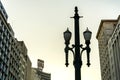 Old vintage street lamp, symbol of the downtown of the city of Sao Paulo, Brazil, with some buildings