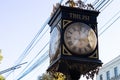 Old, vintage style street clocks in Tbilisi, Georgia, on the blue sky background Royalty Free Stock Photo