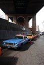 Old vintage taxi and police cars on the streets of New York