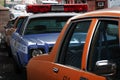 Old vintage taxi and police cars on the streets of New York