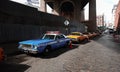 Old vintage taxi and police cars on the streets of New York