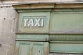 Old vintage taxi sign on wooden office agency of cab driver Royalty Free Stock Photo