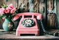 Old vintage telephone with dialer on a wooden table. Nostalgic moods