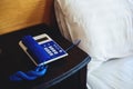 Old vintage telephone on side bed table in bedroom Royalty Free Stock Photo