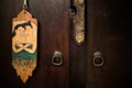 Old vintage Thai style of do not disturb sign hanging in a hotel