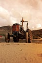 Old Vintage Tractor On Trefor Beach In Wales.