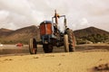 Old vintage tractor on Trefor beach in Wales. Royalty Free Stock Photo
