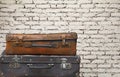 Old vintage travel suitcases over brick wall Royalty Free Stock Photo