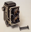 Old vintage twin-lens reflex roll-film camera isolated on a white background Royalty Free Stock Photo