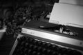 Old vintage typewriter on a desk, cinematic noir scene Royalty Free Stock Photo