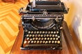 An old vintage Typewriter with spanish keyboard over a wooden desk Royalty Free Stock Photo