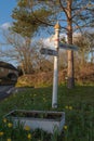 An old vintage village direction signpost in West Chinnock, Somerset