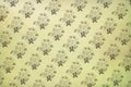 Old vintage wallpaper with a repeating floral pattern