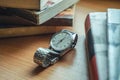 Old vintage watch and some books on a table Royalty Free Stock Photo