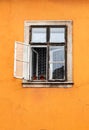 Old weathered window frame and open window in historic house Royalty Free Stock Photo