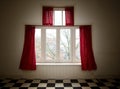 Old vintage window with big red curtains Royalty Free Stock Photo