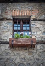 Old Vintage Window With Iron Bars And Flowers In The Pot Royalty Free Stock Photo