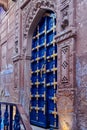 Old vintage wood carved door in blue city of Jodhpur, India